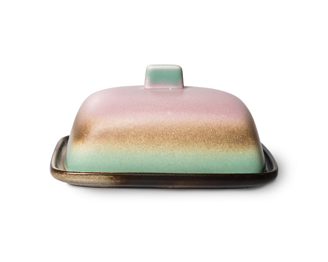 Butterdose MERCURY von HKliving geschlossen von vorn, Deckel in Rosa, Goldbraun und Mint auf dunkelbrauner Platte