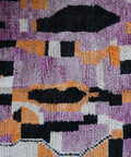 Detail: verschachtelte Blöcke in Lila, Orange, Schwarz und Cremeweiß